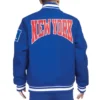 NY Giants Crest Emblem Blue Varsity Jacket back webp