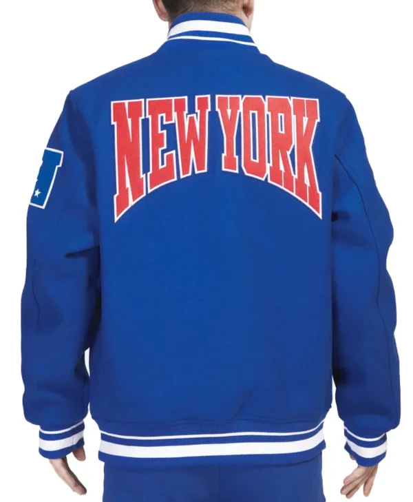 NY Giants Crest Emblem Blue Varsity Jacket back webp