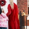 Ted Lasso Juno Temple Long Red Fur Coat back look webp
