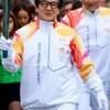 Jackie Chan 2026 Winter Olympics Flame Jacket side pose