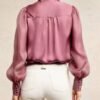 The Traitors UK S4 Claudia Winkleman Pink Neck-Tie Satin Blouse Shop Now