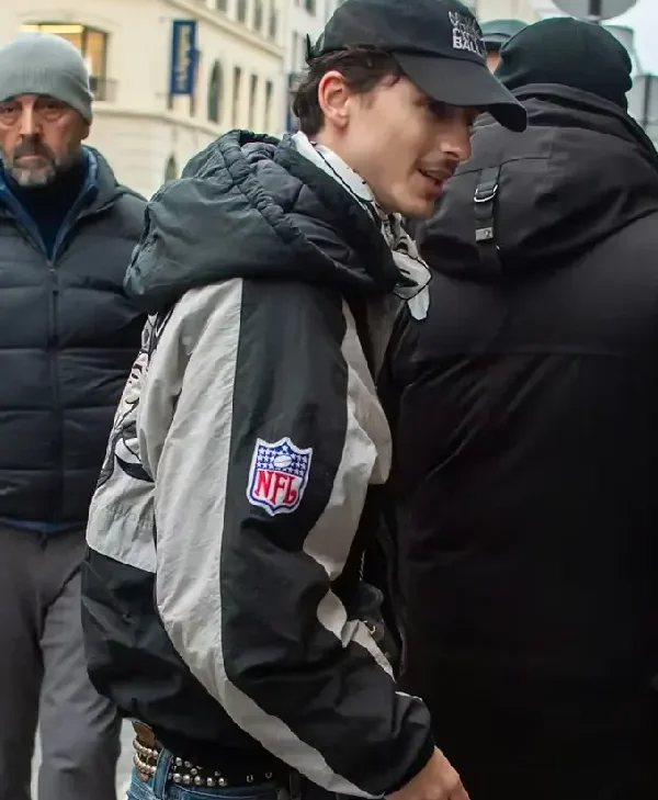 Timothée Chalamet Raiders Jacket side pose
